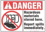 Danger Sign, Hazardous Materials Stored Here. Report Spills Immediately (With Symbol) 